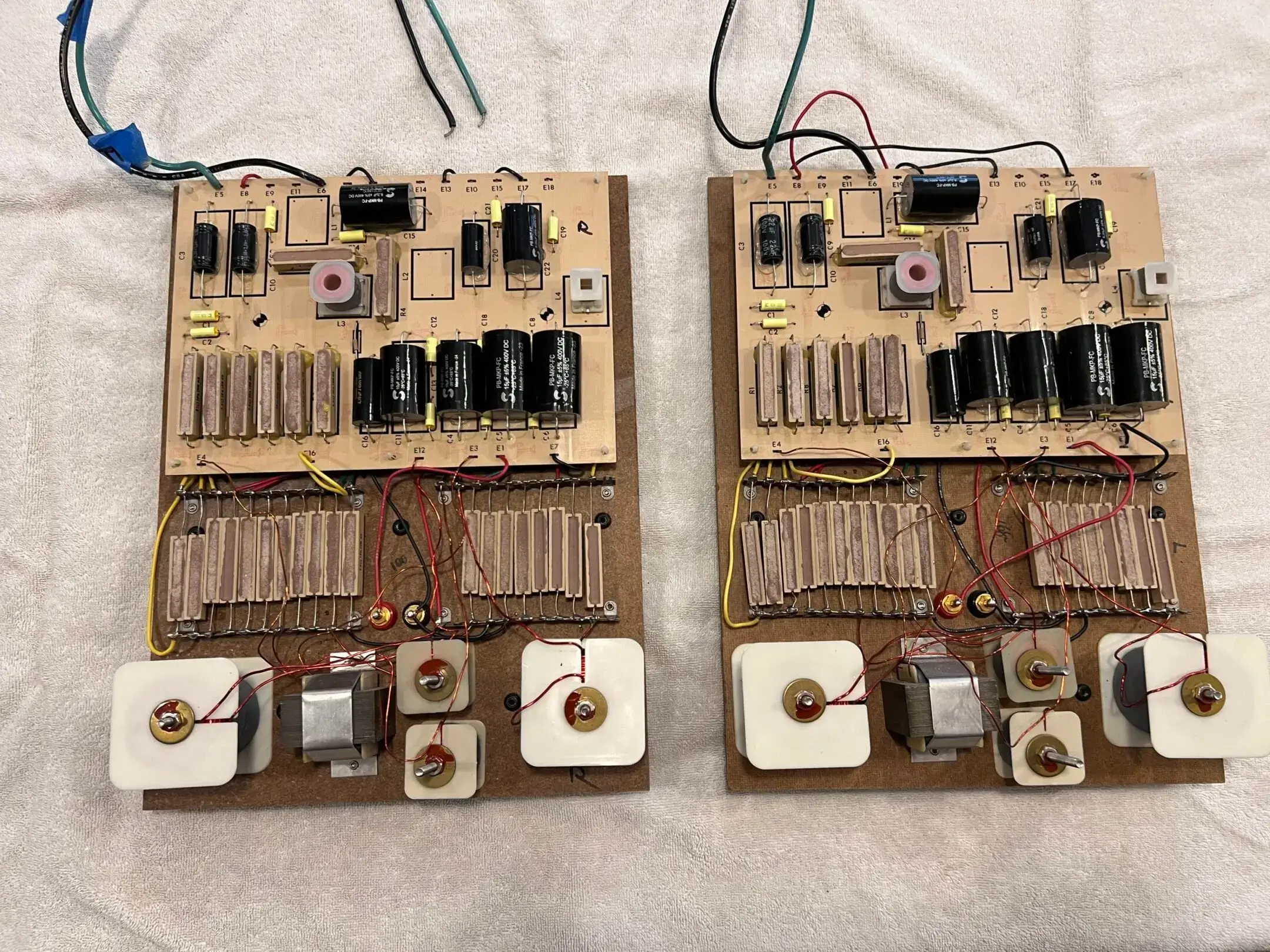 IMG_3381-scaled-e1737588387971 (1) Two boards with many different electrical components on them.